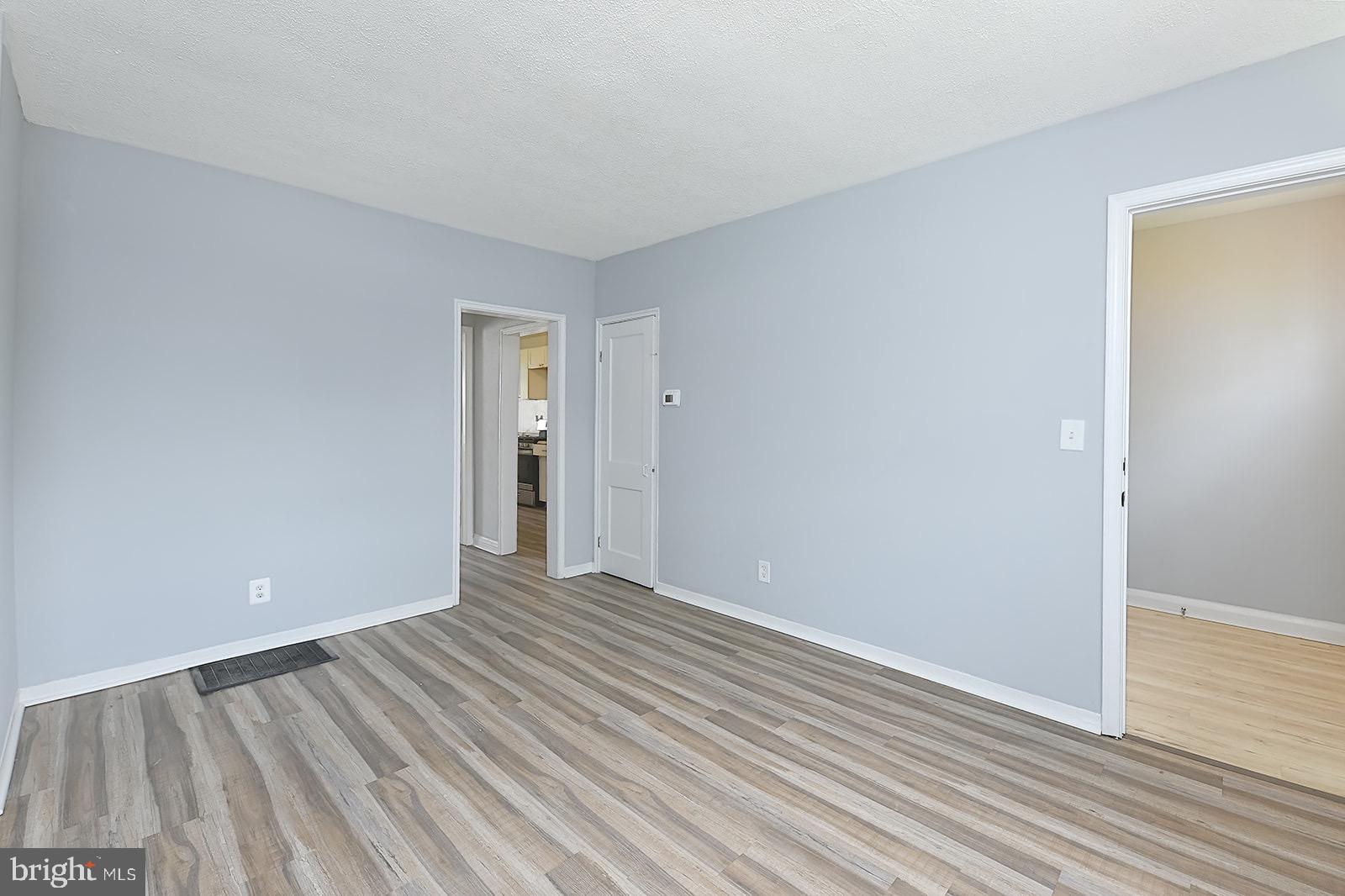 2995 Yorkway, Unit 1 Dundalk, MD 21222 - Photo 8 of 19 a view of an empty room with wooden floor