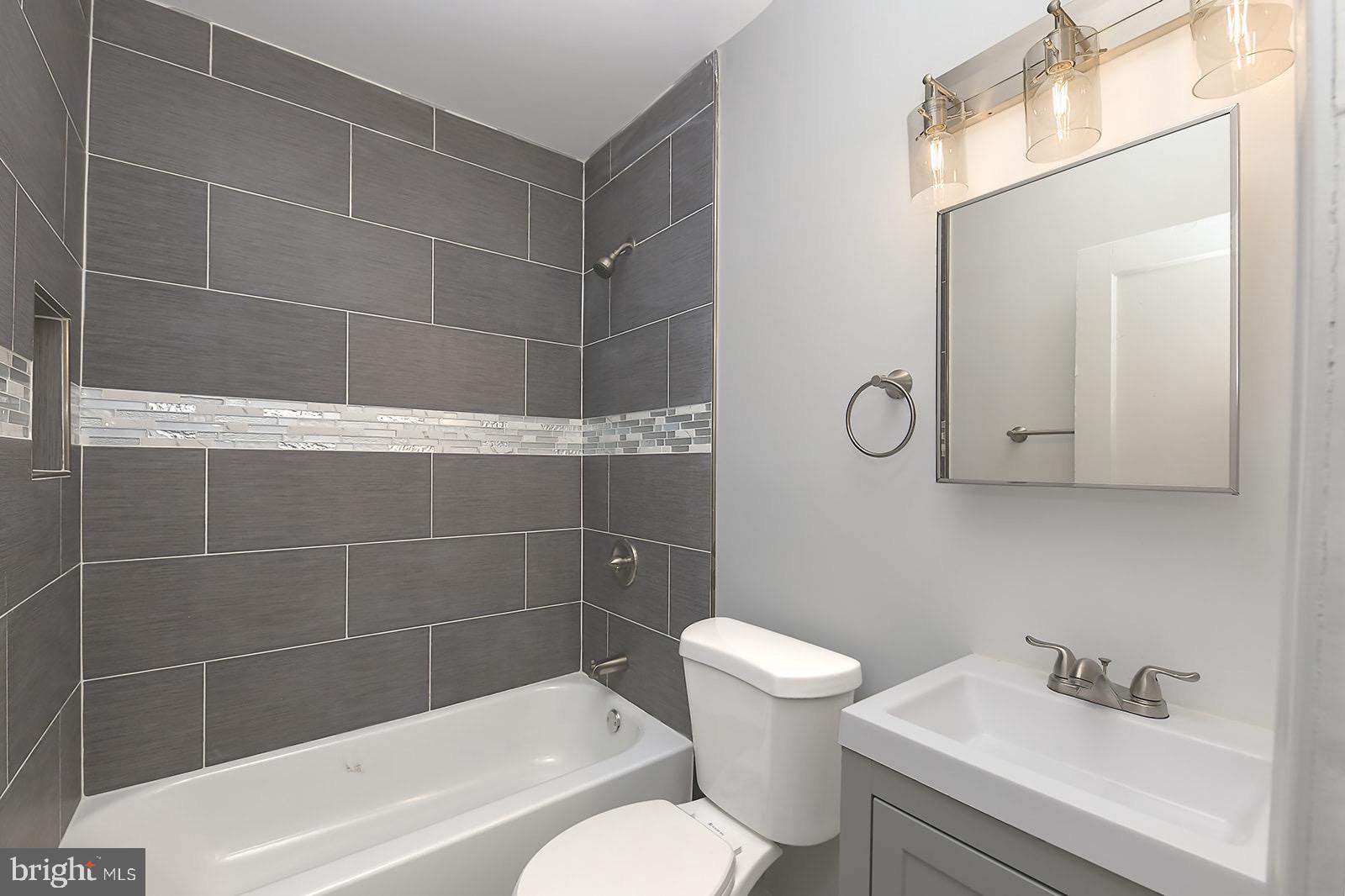 2995 Yorkway, Unit 1 Dundalk, MD 21222 - Photo 9 of 19 a bathroom with a toilet and shower