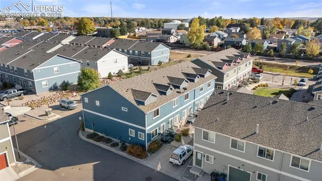 an aerial view of residential houses with outdoor space