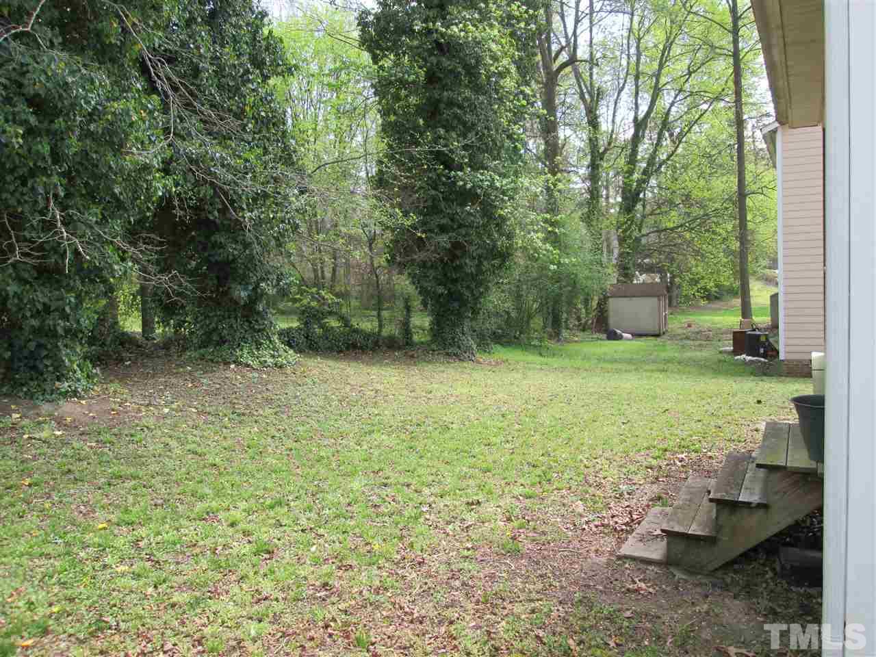 745 Rawls Drive Raleigh, NC 27610 - Photo 3 of 5 a view of a trees with a yard