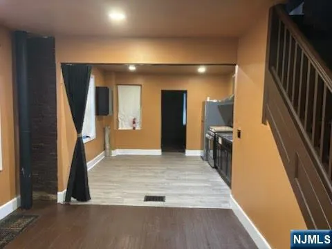 a view of entryway with wooden floor