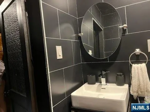 a bathroom with a sink and mirror