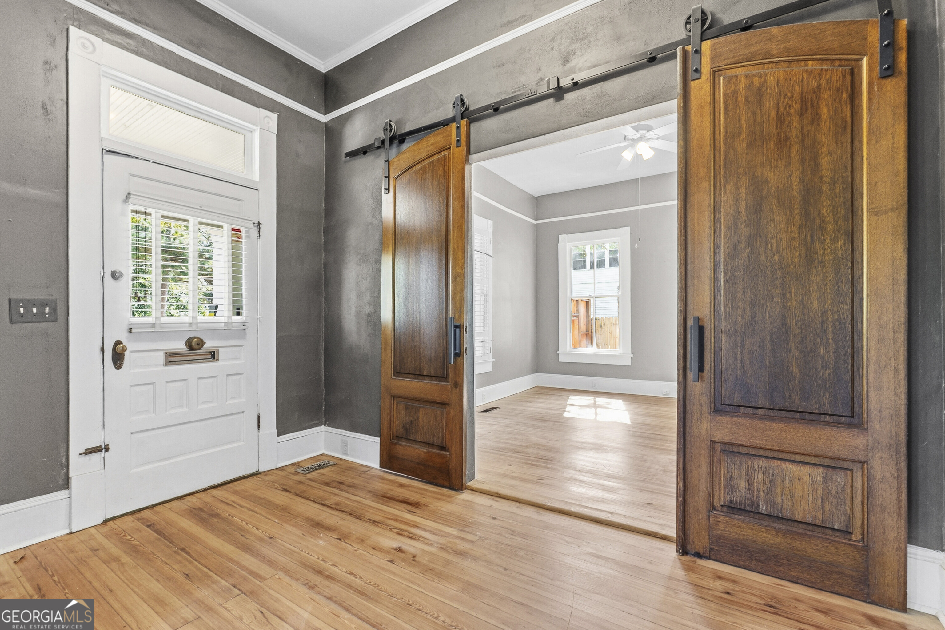 216 Hines Terrace Macon, GA 31204 - Photo 11 of 52 a view of empty room with wooden floor and cabinet