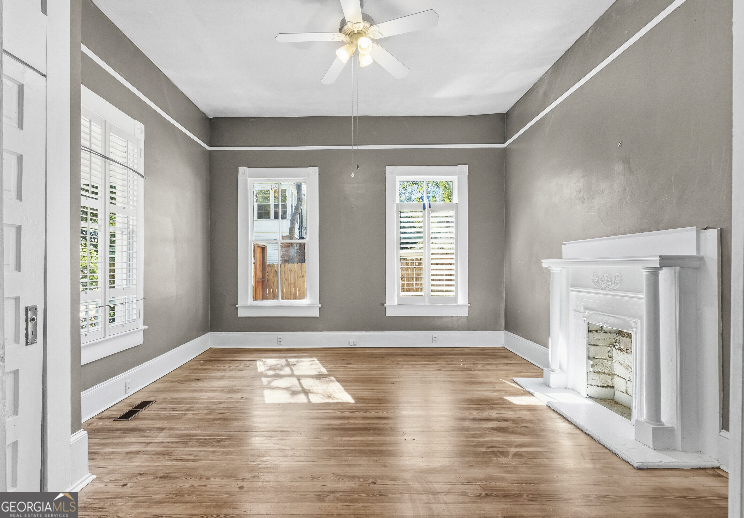 216 Hines Terrace Macon, GA 31204 - Photo 13 of 52 a view of empty room with wooden floor and fan