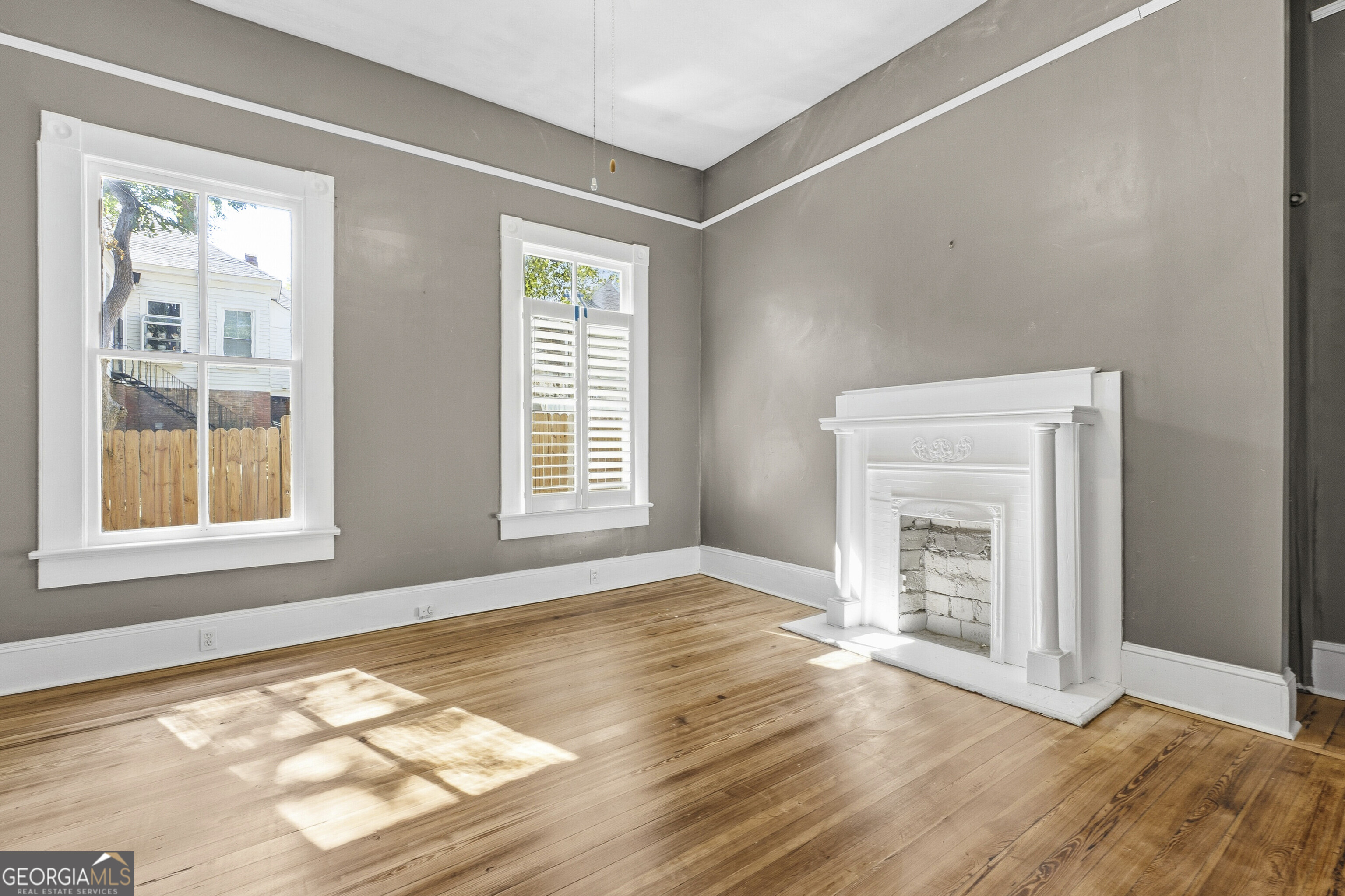 216 Hines Terrace Macon, GA 31204 - Photo 14 of 52 an empty room with windows and fireplace