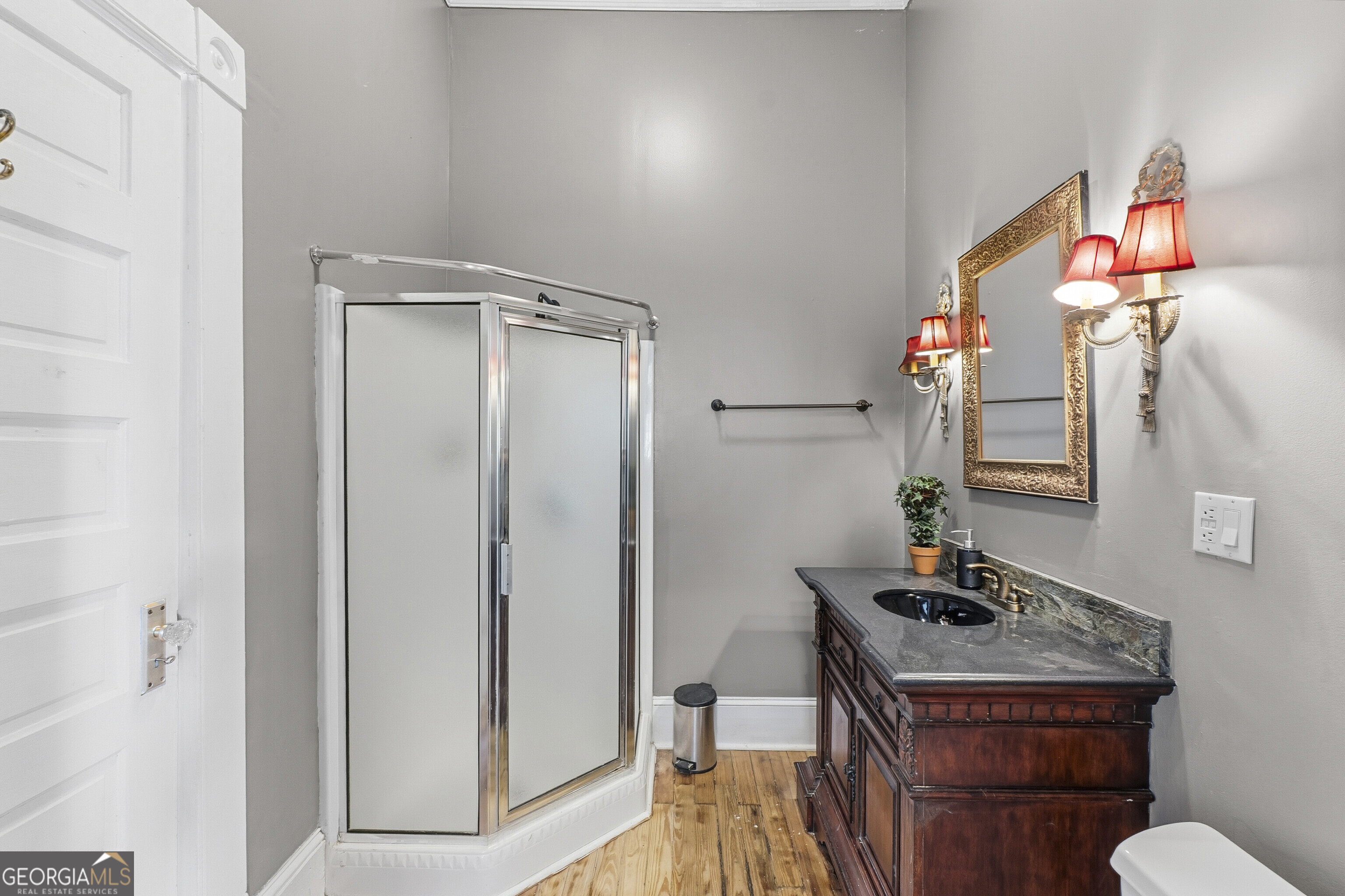 216 Hines Terrace Macon, GA 31204 - Photo 18 of 52 a bathroom with a sink a toilet and a mirror