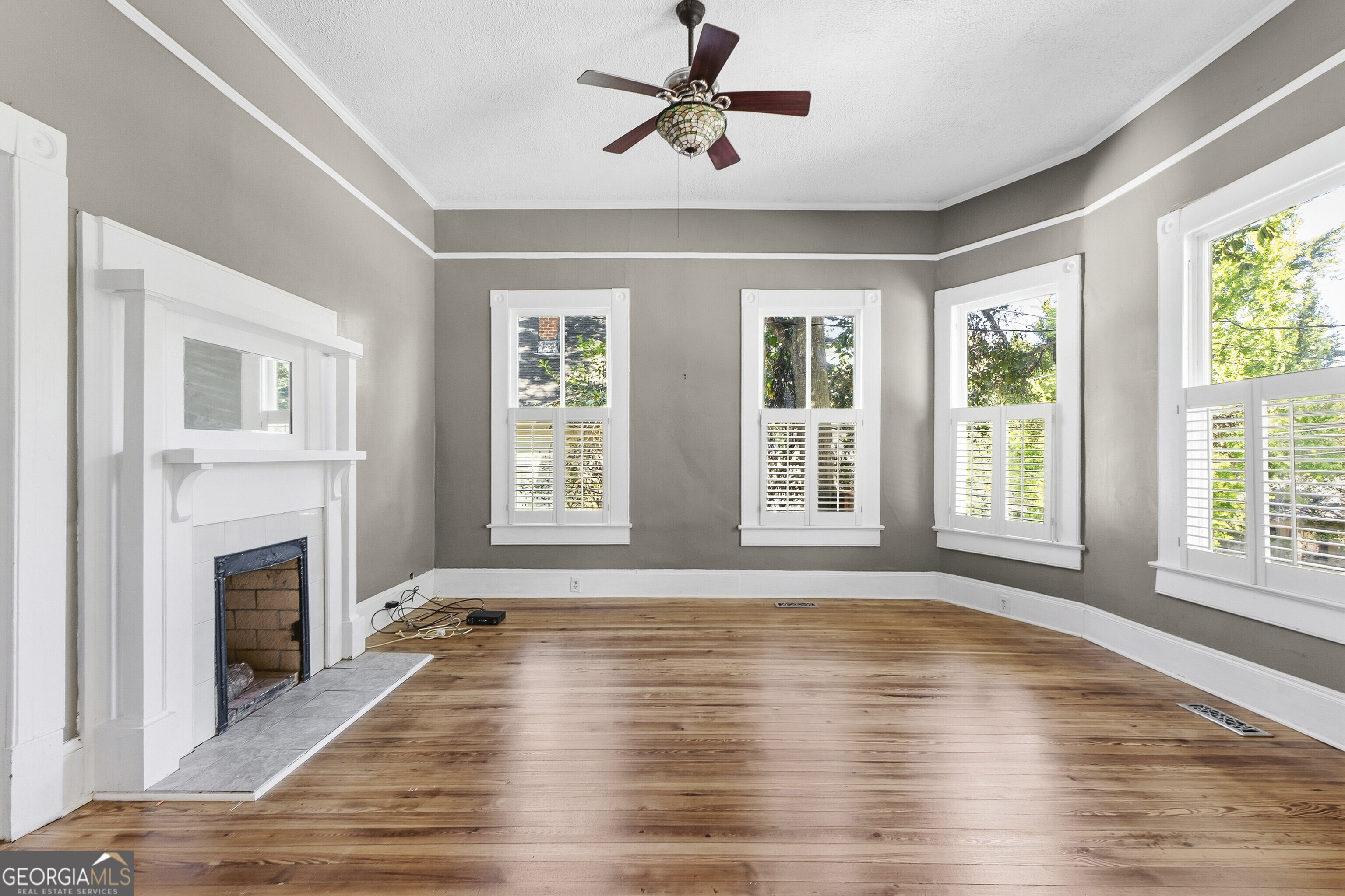 216 Hines Terrace Macon, GA 31204 - Photo 20 of 52 a view of an empty room with wooden floor and a window