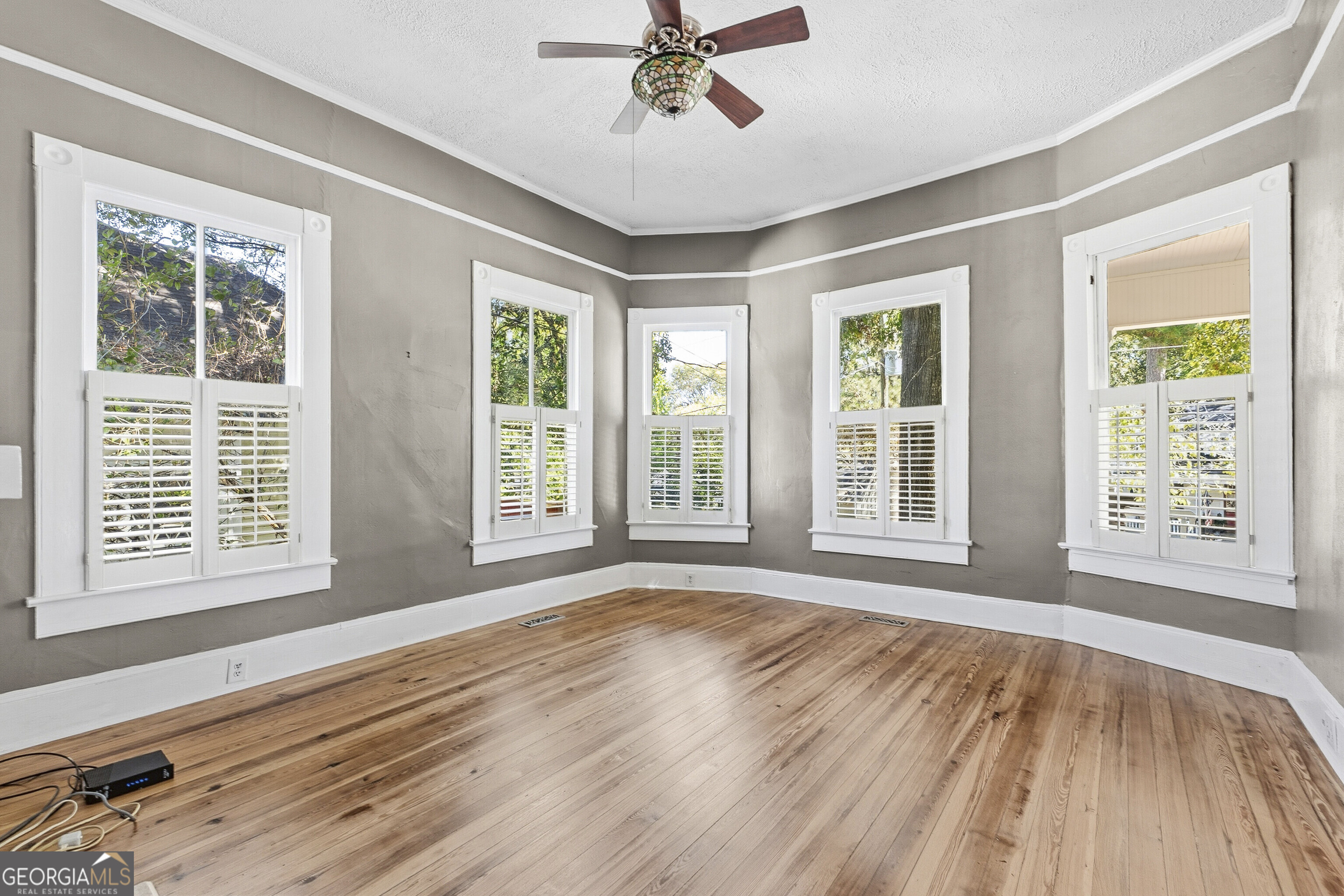 216 Hines Terrace Macon, GA 31204 - Photo 21 of 52 a view of an empty room with a window and wooden floor