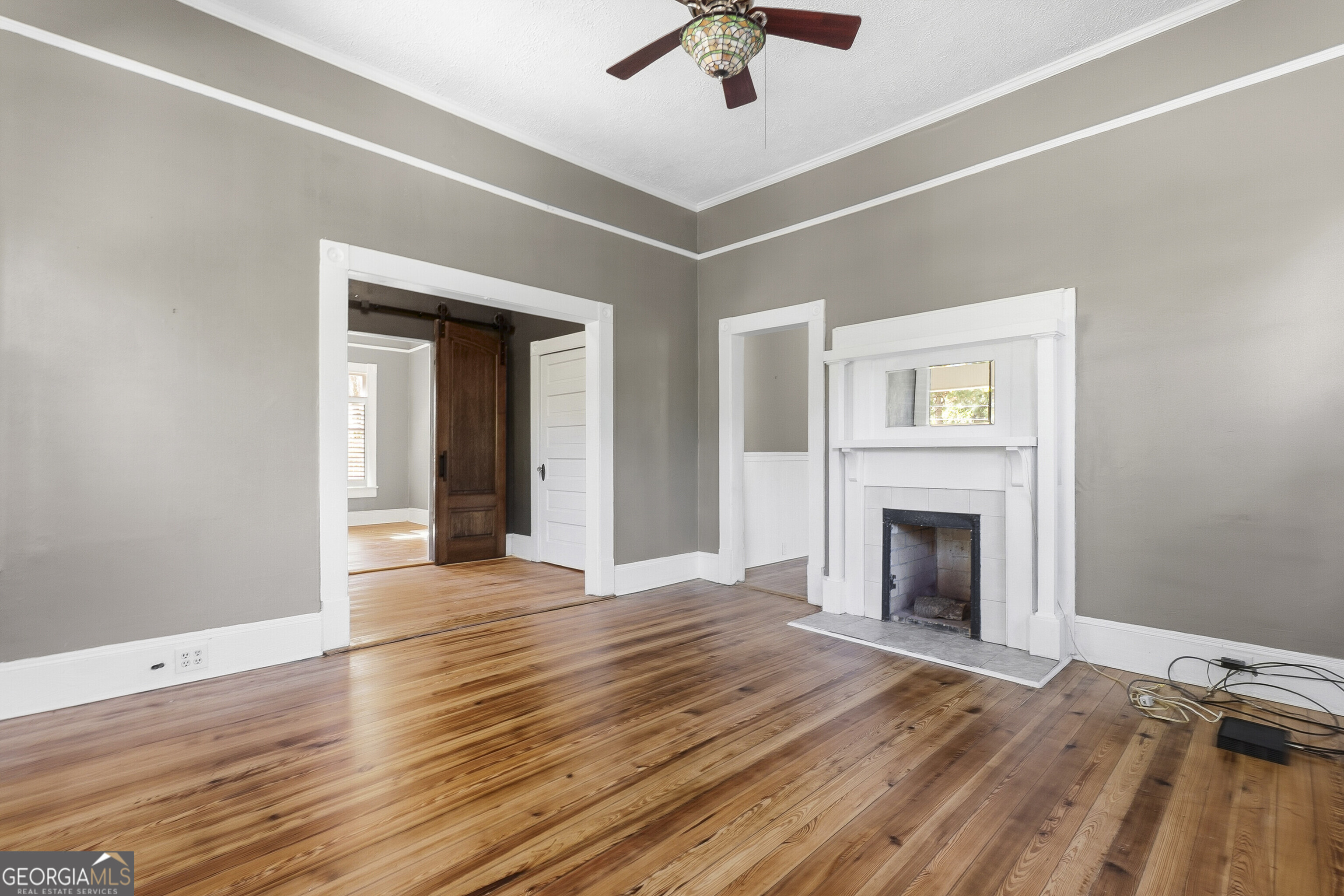 216 Hines Terrace Macon, GA 31204 - Photo 23 of 52 a view of empty room with wooden floor and fireplace