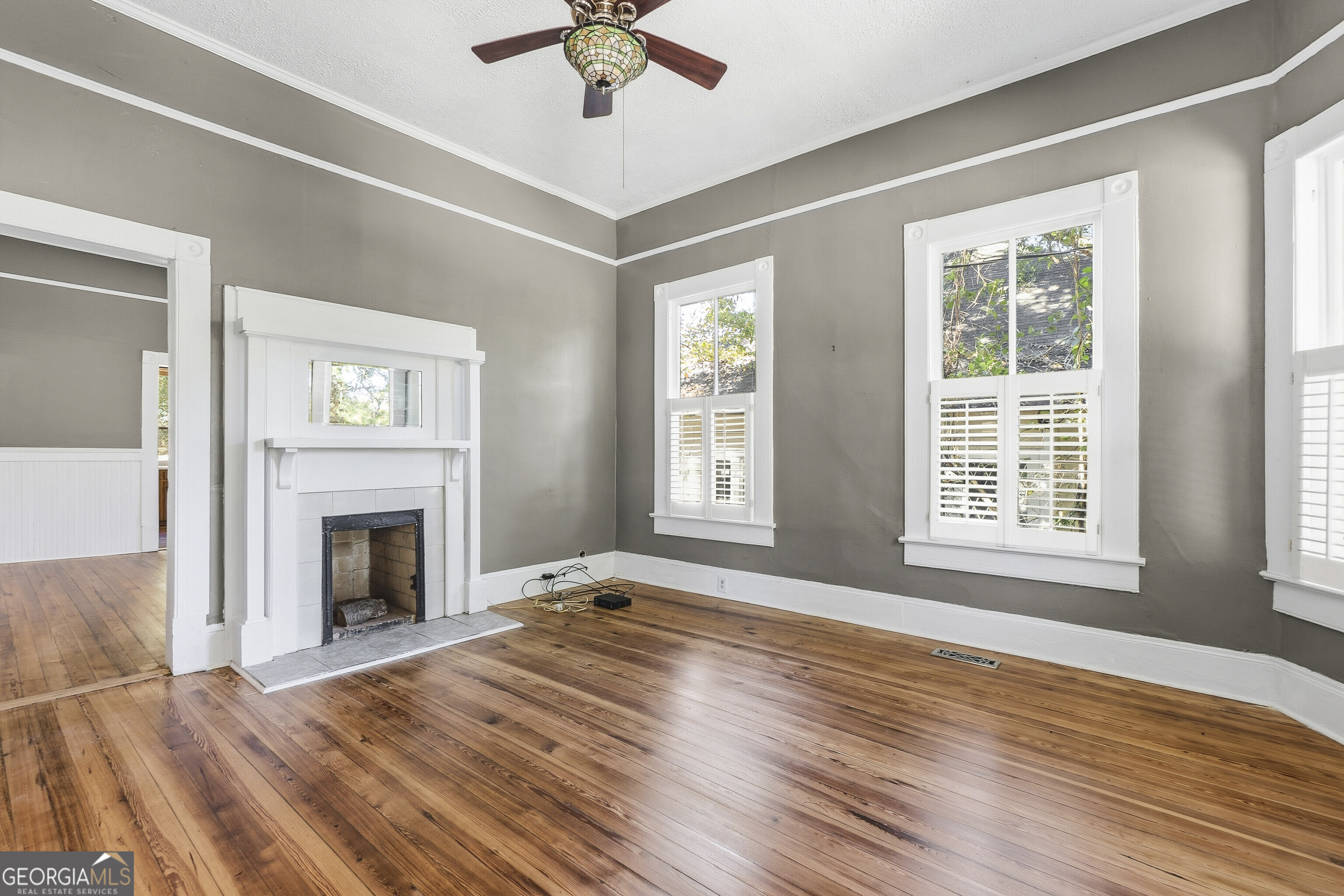 216 Hines Terrace Macon, GA 31204 - Photo 24 of 52 a view of an empty room with window and wooden floor