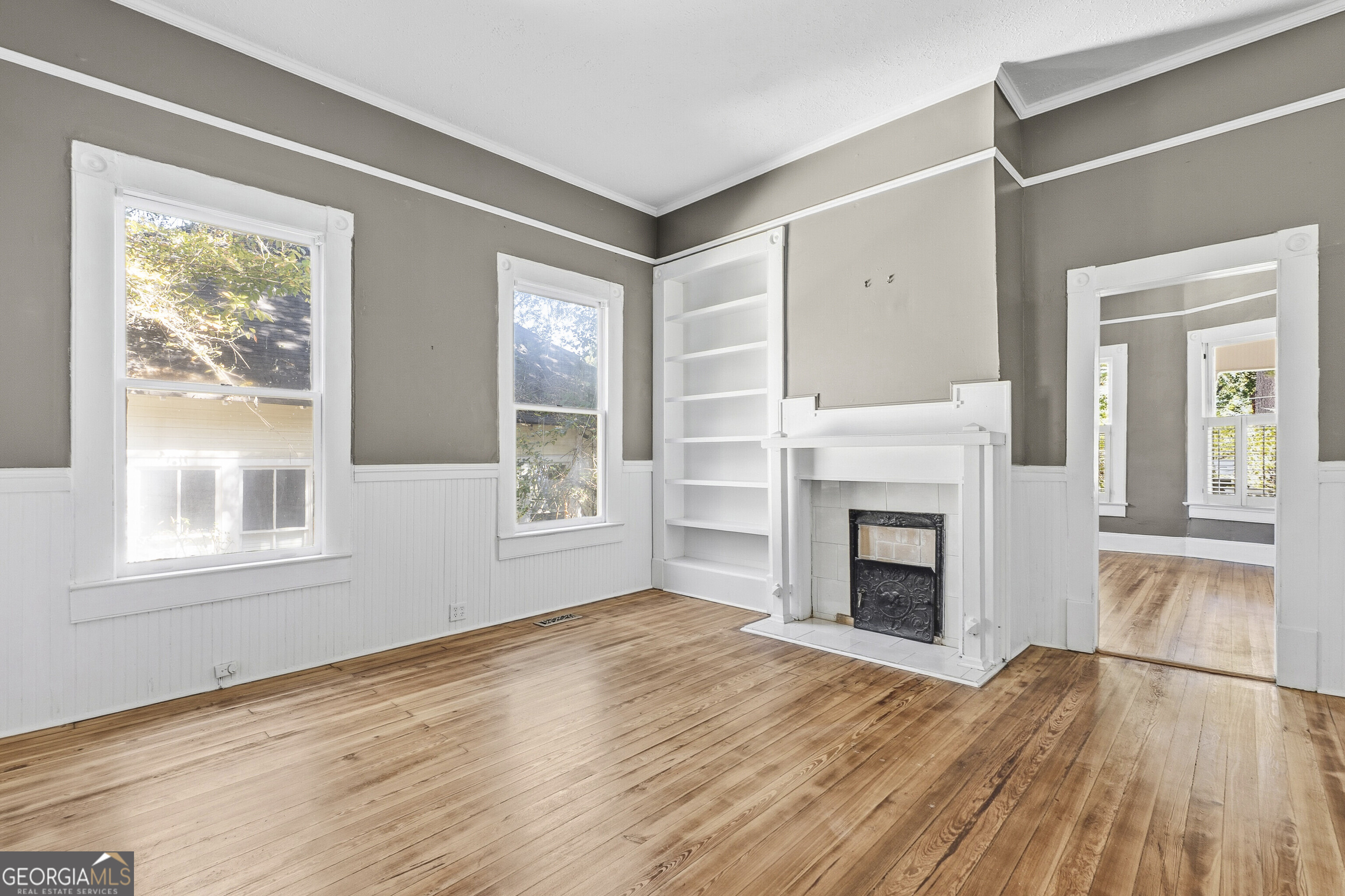 216 Hines Terrace Macon, GA 31204 - Photo 26 of 52 a view of an empty room with wooden floor and a window