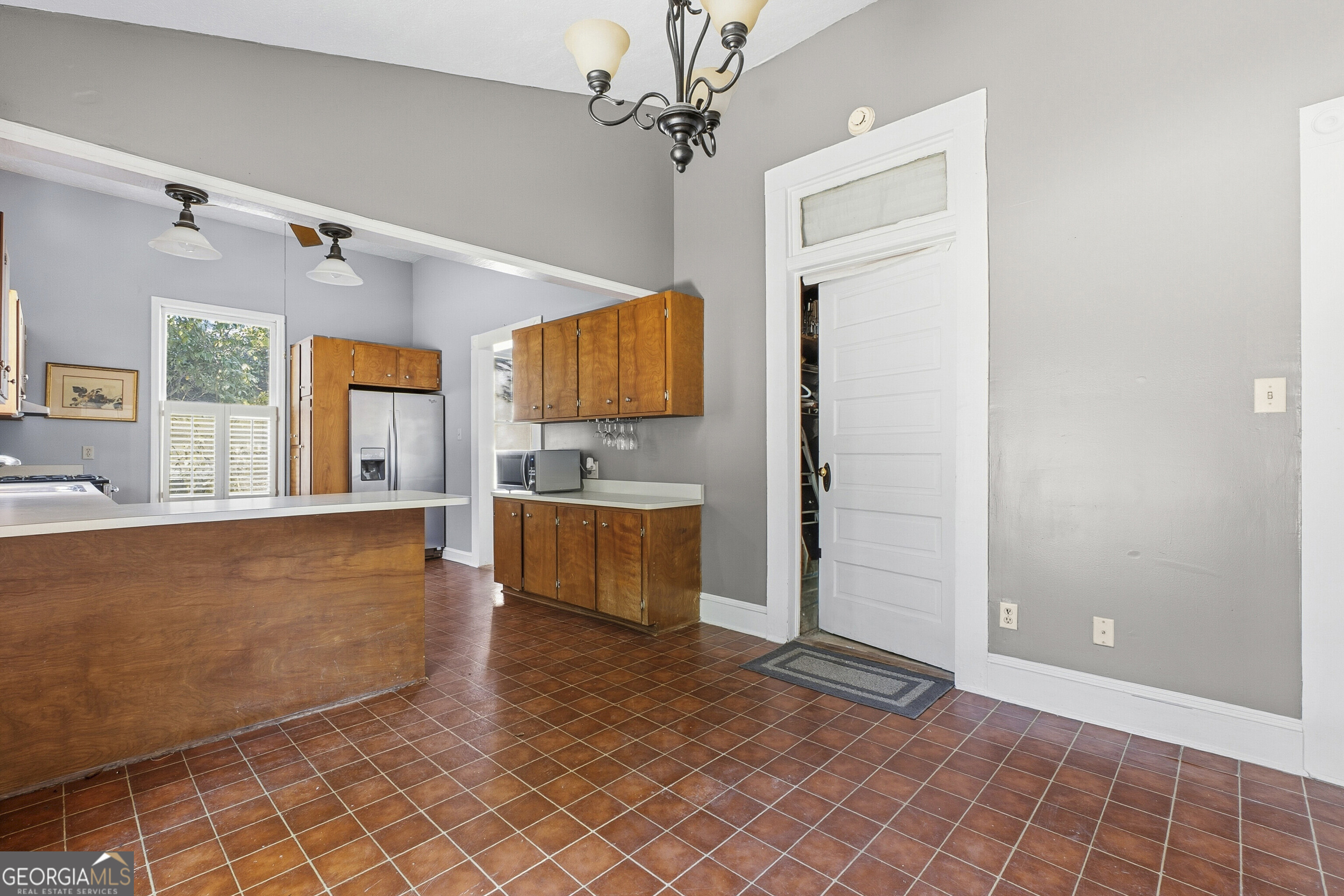 216 Hines Terrace Macon, GA 31204 - Photo 38 of 52 a view of a kitchen with a sink and a refrigerator