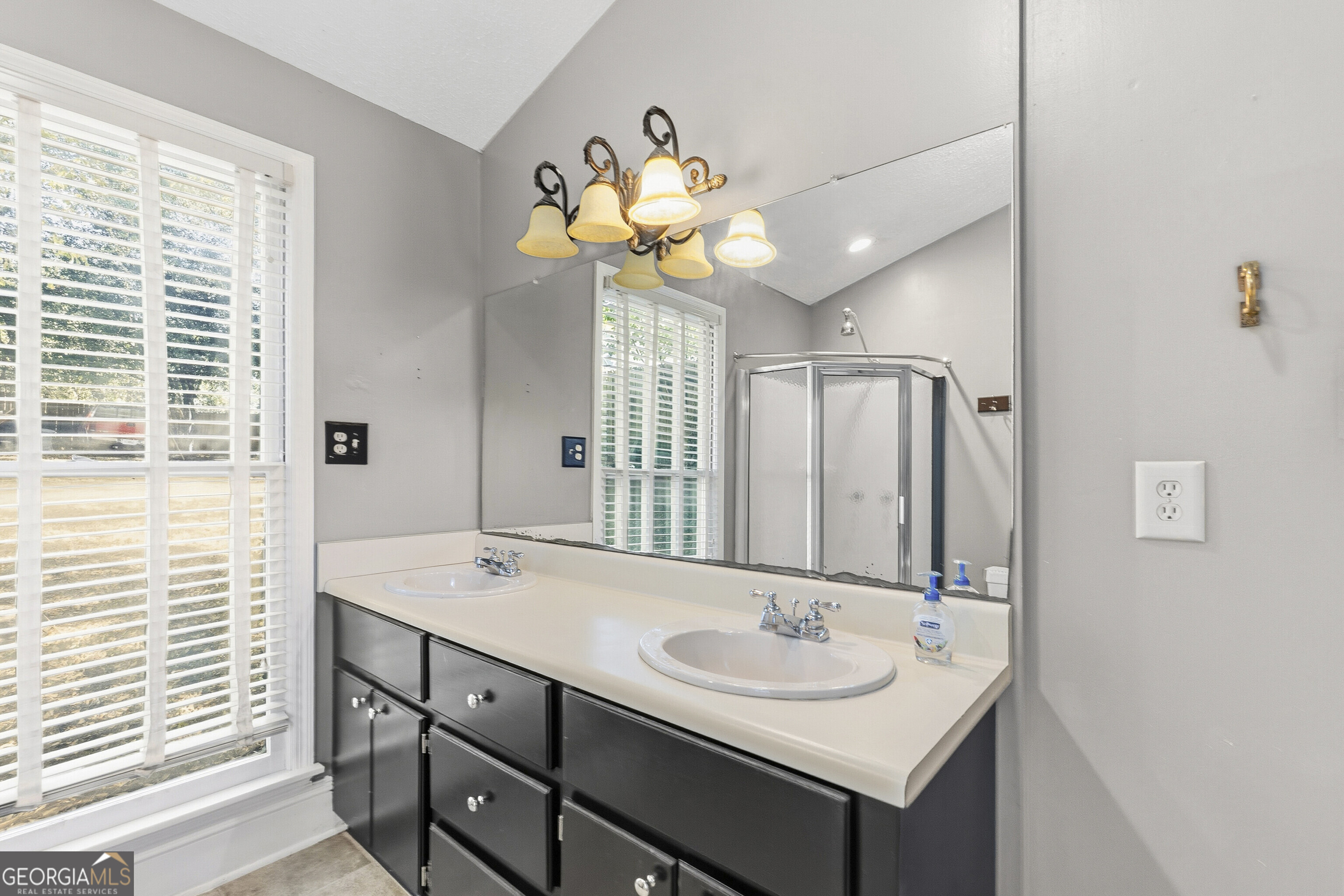 216 Hines Terrace Macon, GA 31204 - Photo 41 of 52 a bathroom with a sink a vanity and a mirror