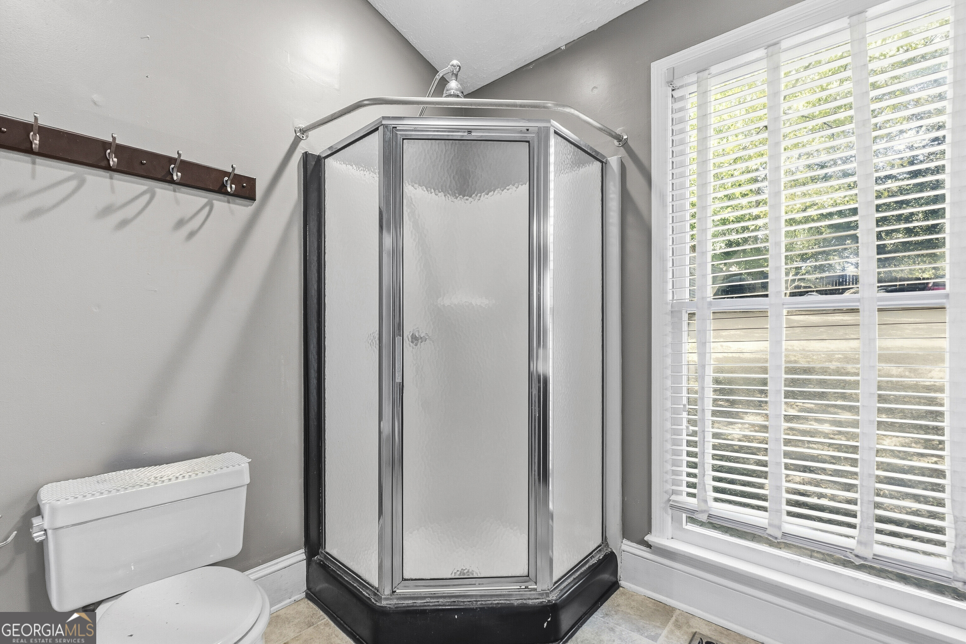 216 Hines Terrace Macon, GA 31204 - Photo 43 of 52 a bathroom with a toilet and a shower