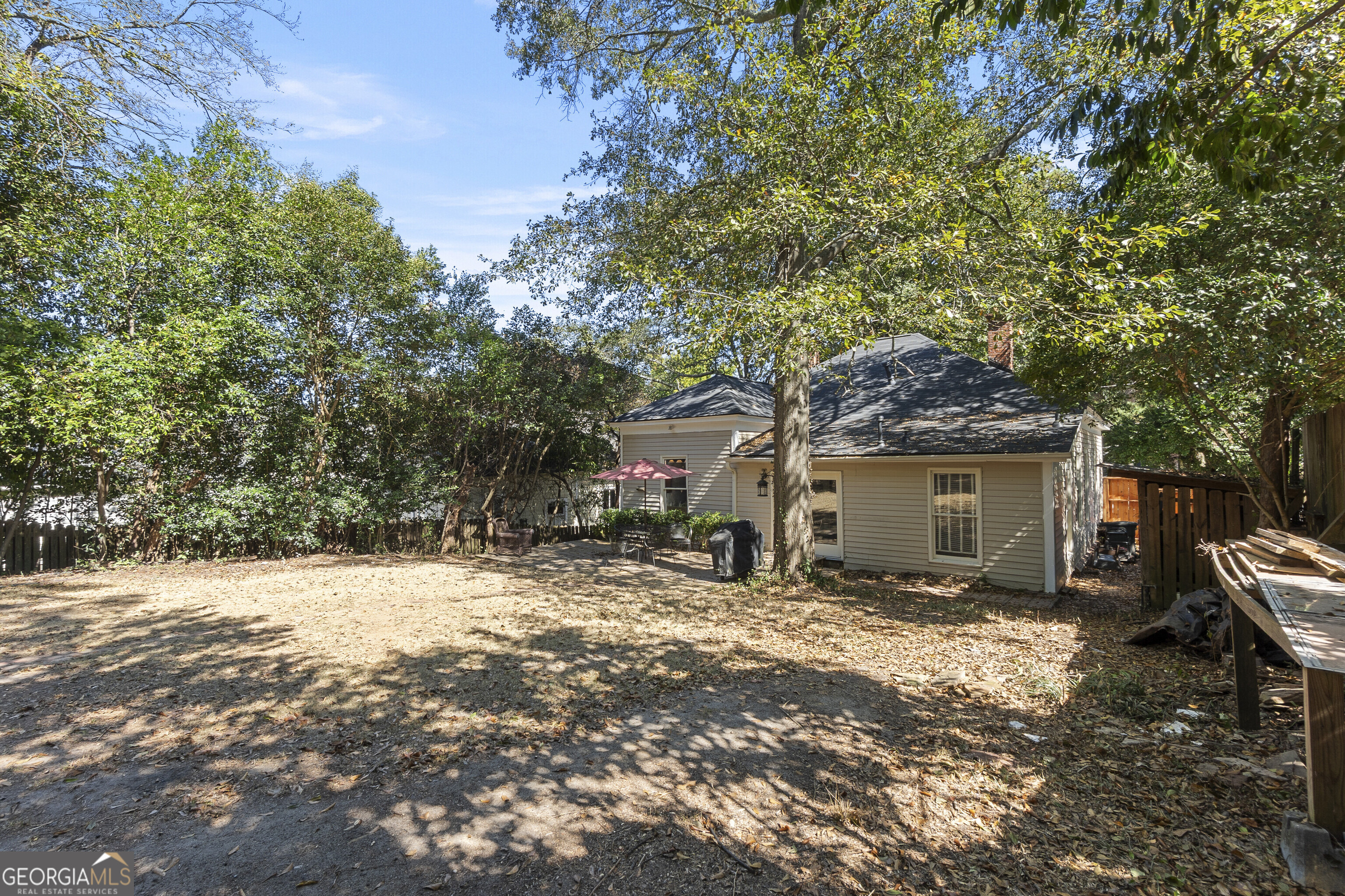 216 Hines Terrace Macon, GA 31204 - Photo 51 of 52 a backyard of a house with yard and outdoor seating