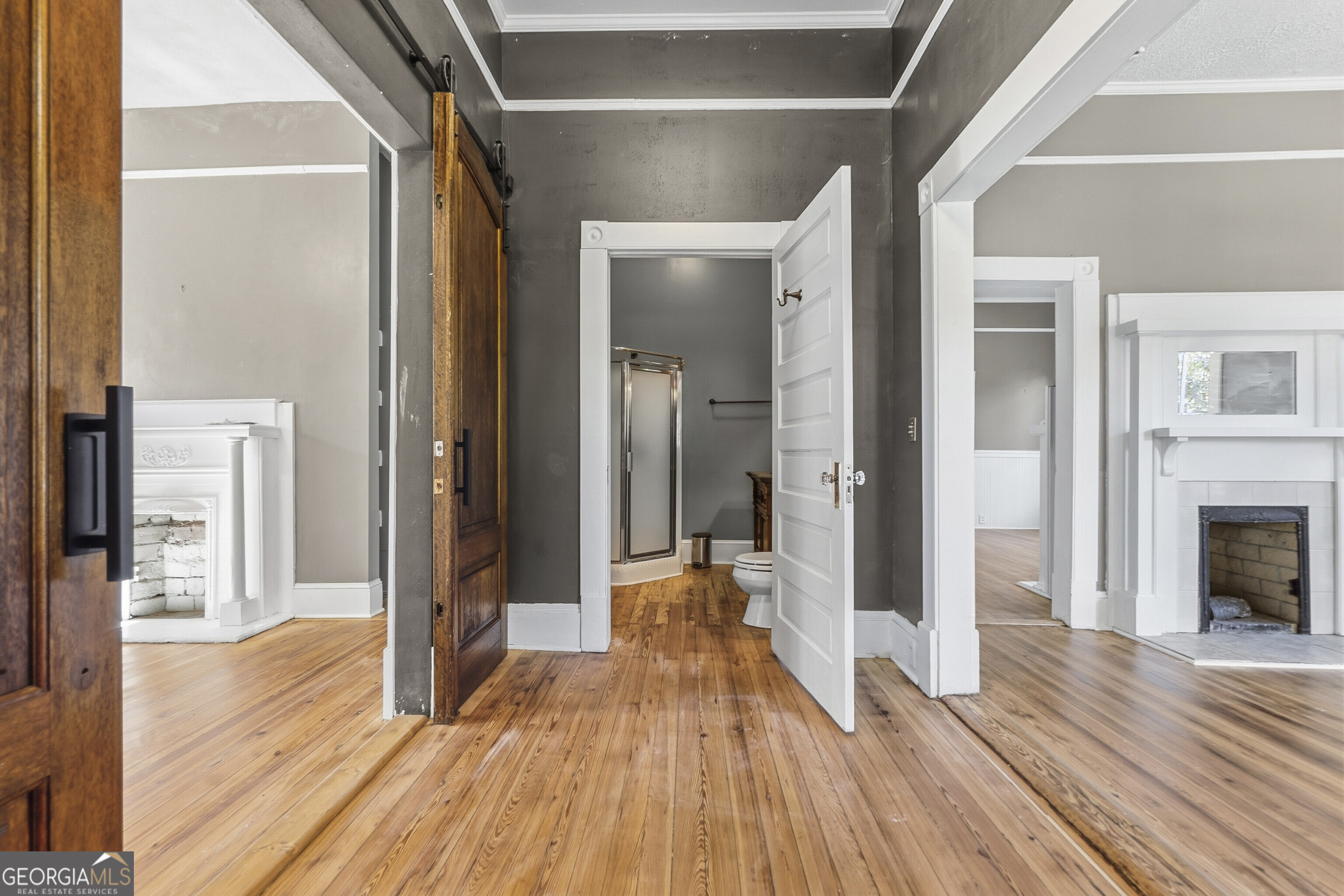 216 Hines Terrace Macon, GA 31204 - Photo 10 of 52 a view of a hallway with wooden floor and a fireplace
