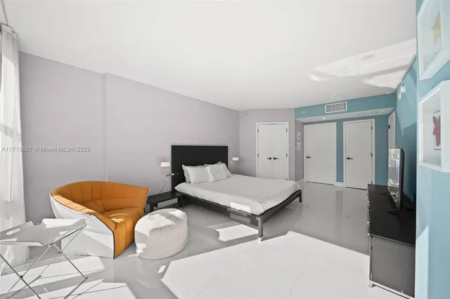 a bathroom with a tub shower and mirror