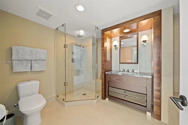 a bathroom with a tub shower and sink