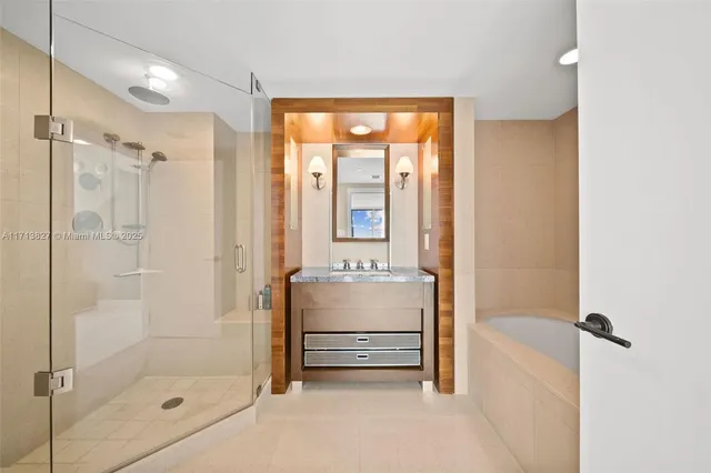 a bathroom with a double vanity sink toilet and shower