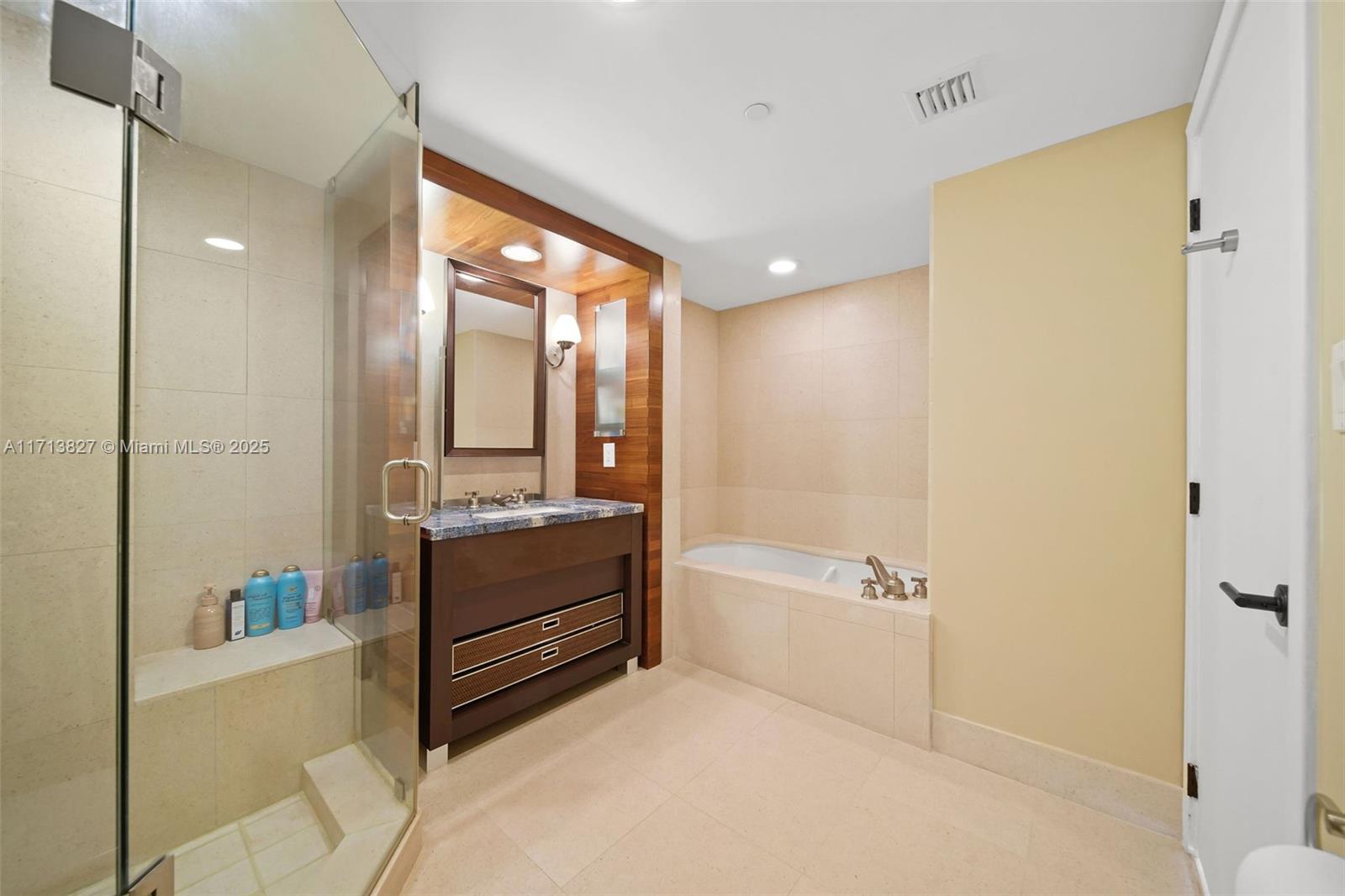 6801 Collins Avenue, Unit 1214 Miami Beach, FL 33141 - Photo 16 of 59 a bathroom with a tub shower and sink