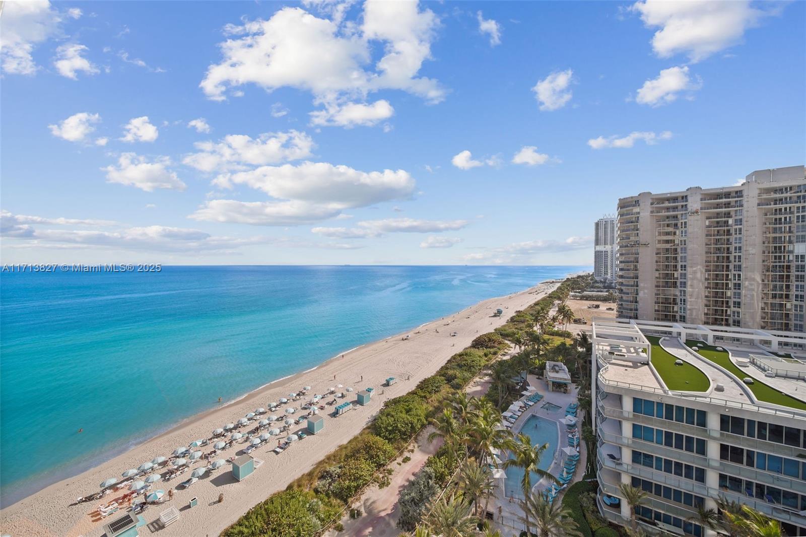 6801 Collins Avenue, Unit 1214 Miami Beach, FL 33141 - Photo 22 of 59 a view of swimming pool with outdoor space and seating area