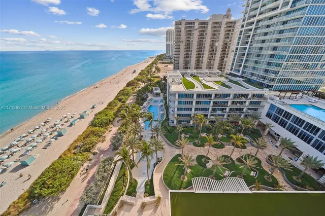 a large white kitchen with a large window