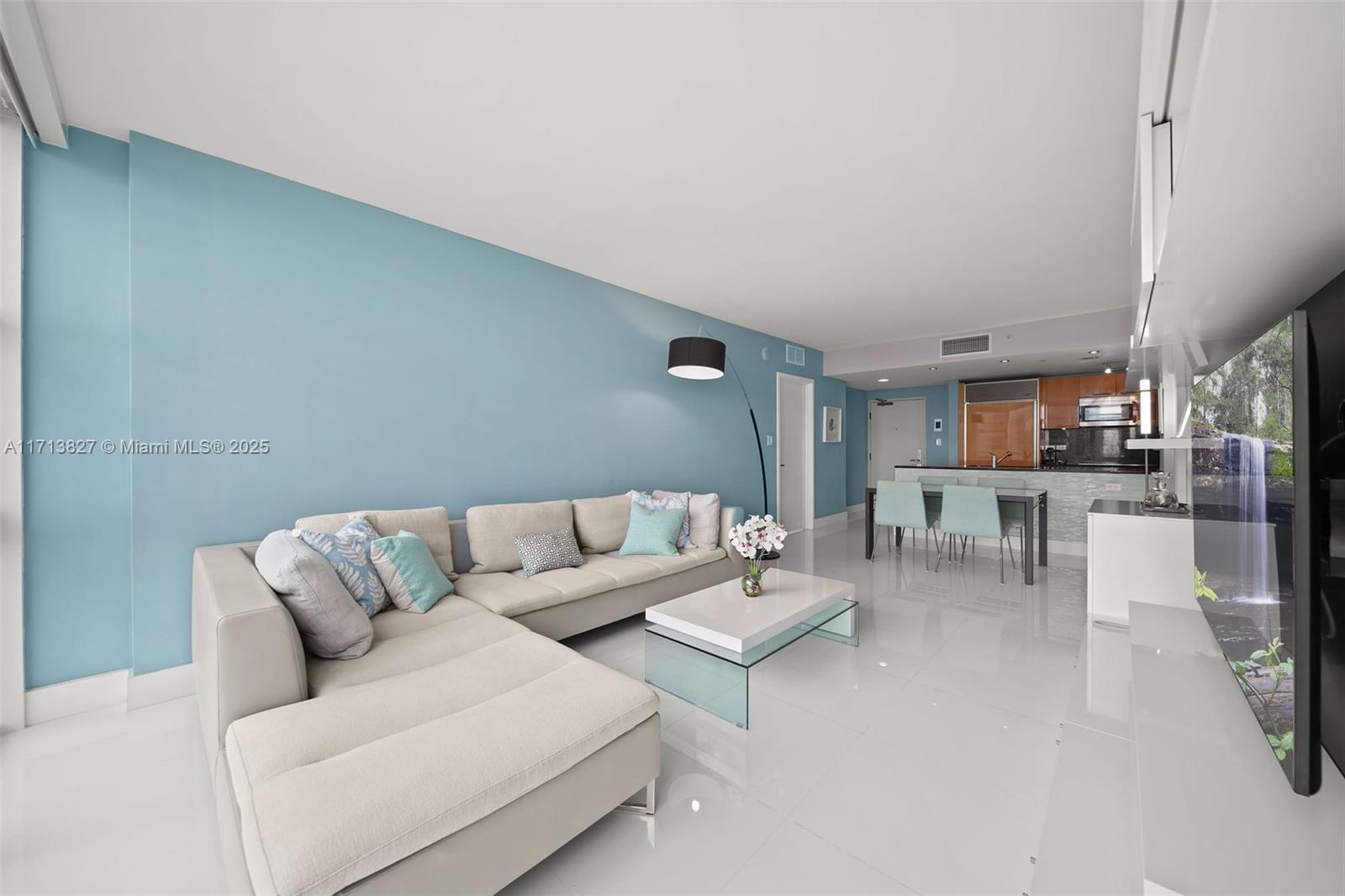 6801 Collins Avenue, Unit 1214 Miami Beach, FL 33141 - Photo 7 of 59 a living room with furniture and a couch