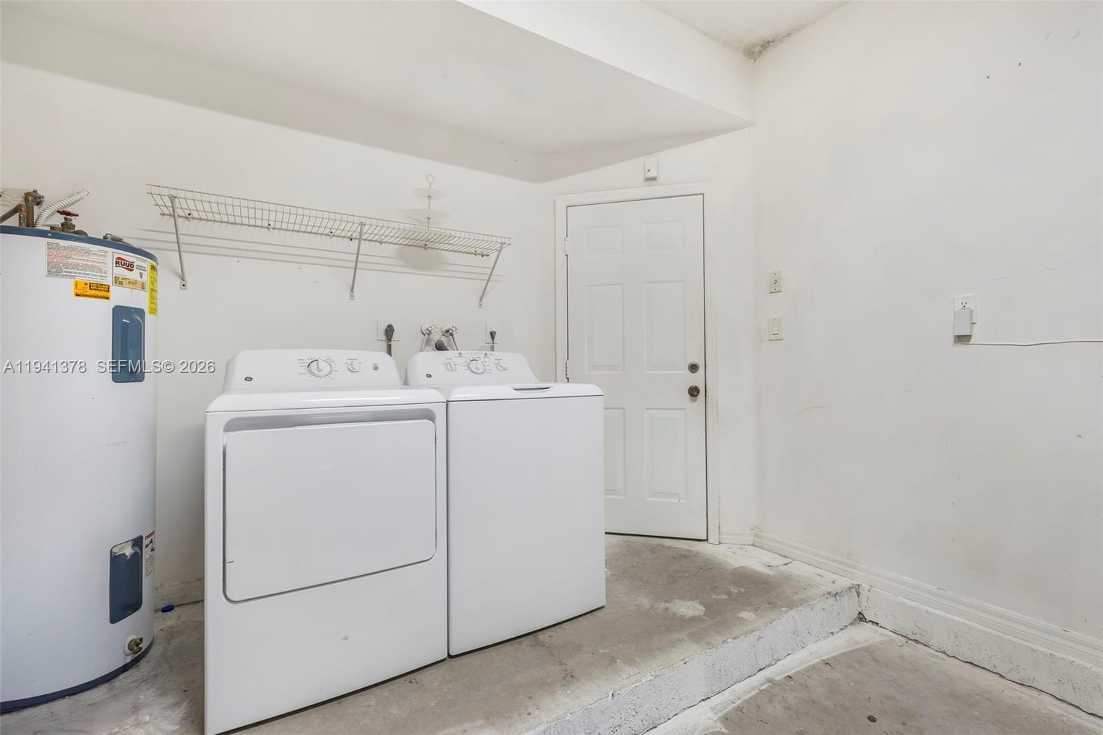 8331 Southwest 124th Avenue, Unit 10414 Miami, FL 33183 - Photo 12 of 24 a utility room with dryer and washer