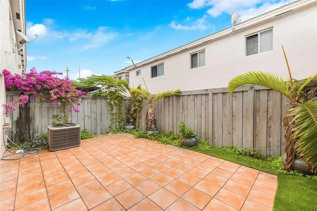 a view of a backyard with sitting area