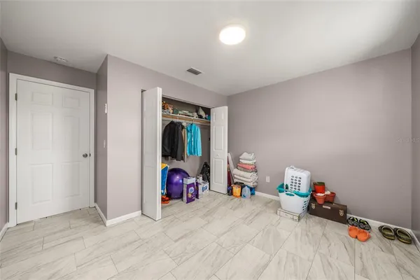 a view of a room with toys and a ceiling fan