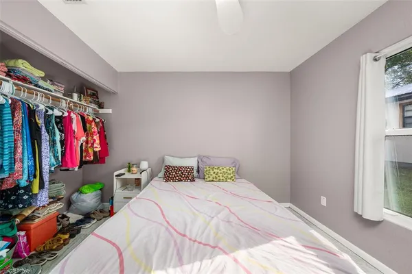 a bed room with a bed and a walk in closet