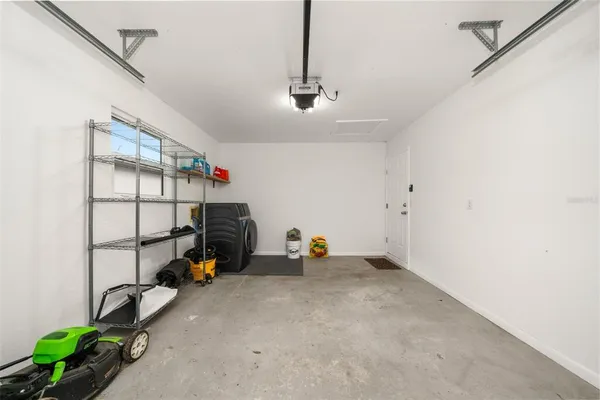 a view of a table and chairs in the garden