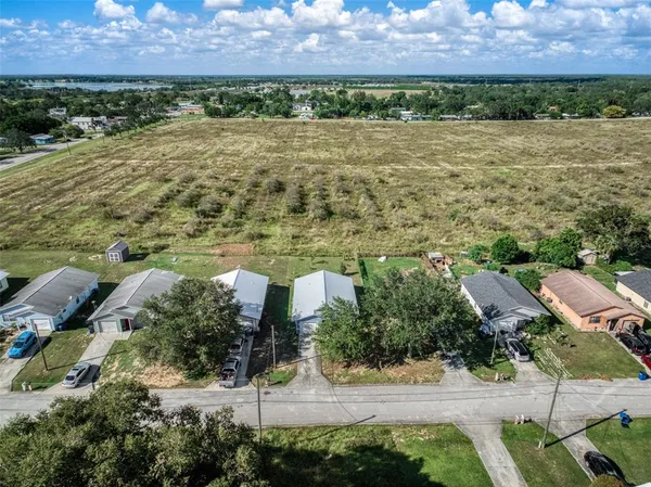 a view of a garden with a building in the background