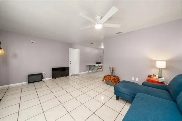 a bedroom with a bed and a lamp