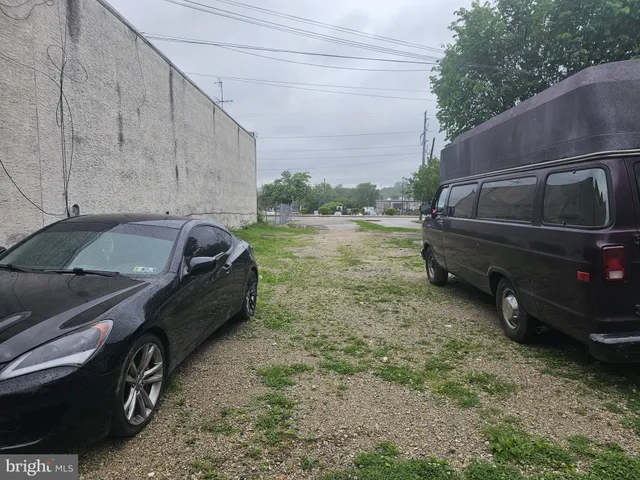 a view of a backyard with sitting area