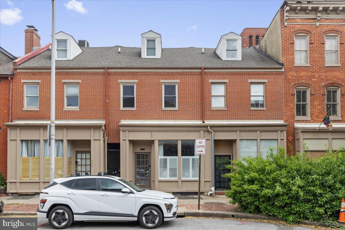 731 South Hanover Street, Unit R2 Baltimore, MD 21230 - Photo 17 of 17 a front view of a building with parking space