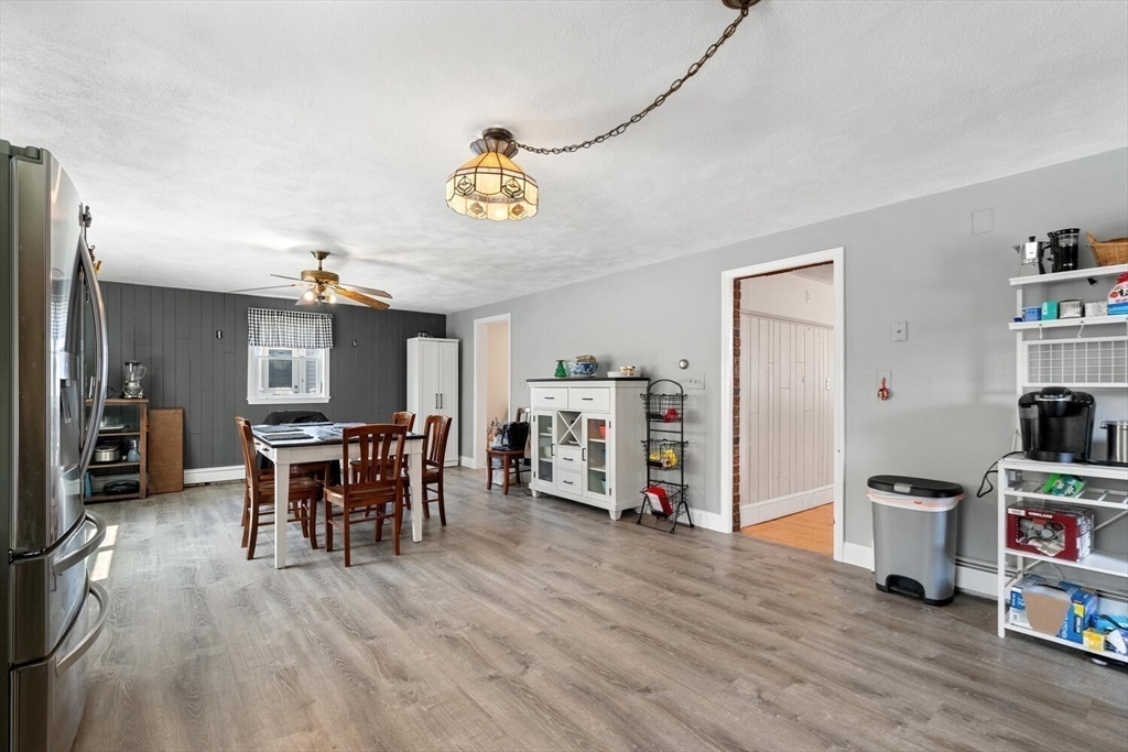 152 Springvale Avenue Everett, MA 02149 - Photo 11 of 30 a view of a dining room with furniture and wooden floor