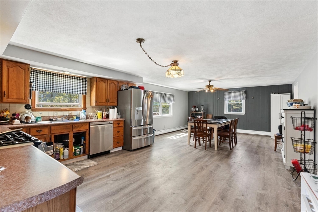 152 Springvale Avenue Everett, MA 02149 - Photo 12 of 30 a view of a dining room with furniture window and wooden floor