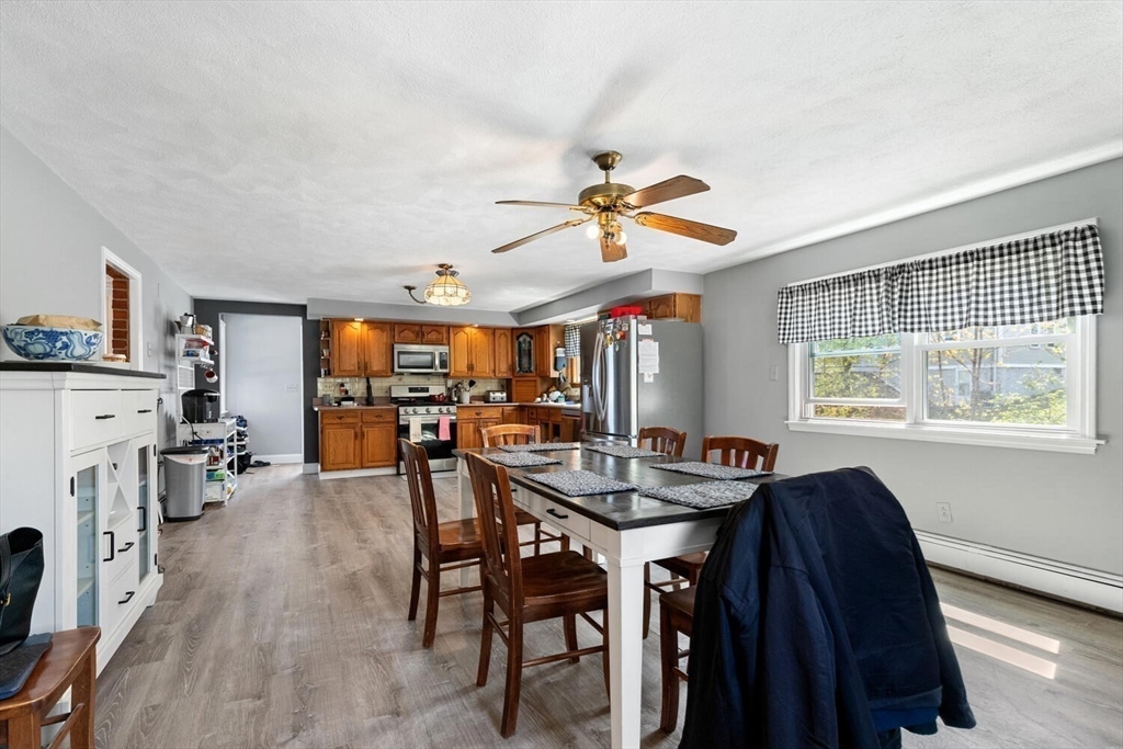 152 Springvale Avenue Everett, MA 02149 - Photo 13 of 30 a view of a a dining room with furniture window and wooden floor