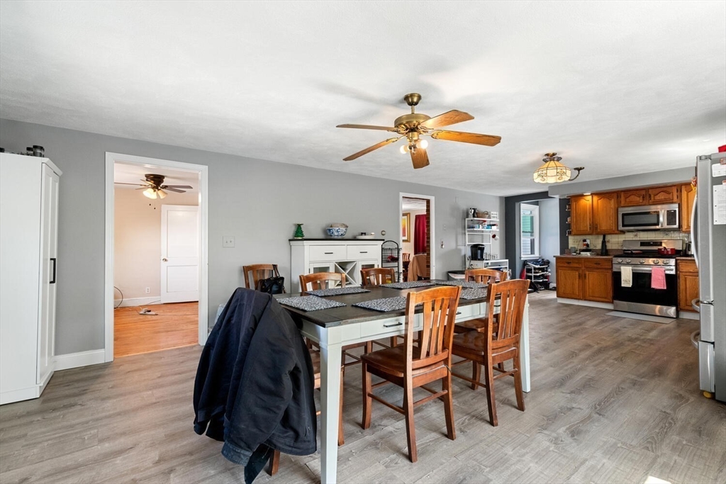 152 Springvale Avenue Everett, MA 02149 - Photo 14 of 30 a view of a dining room with furniture and wooden floor