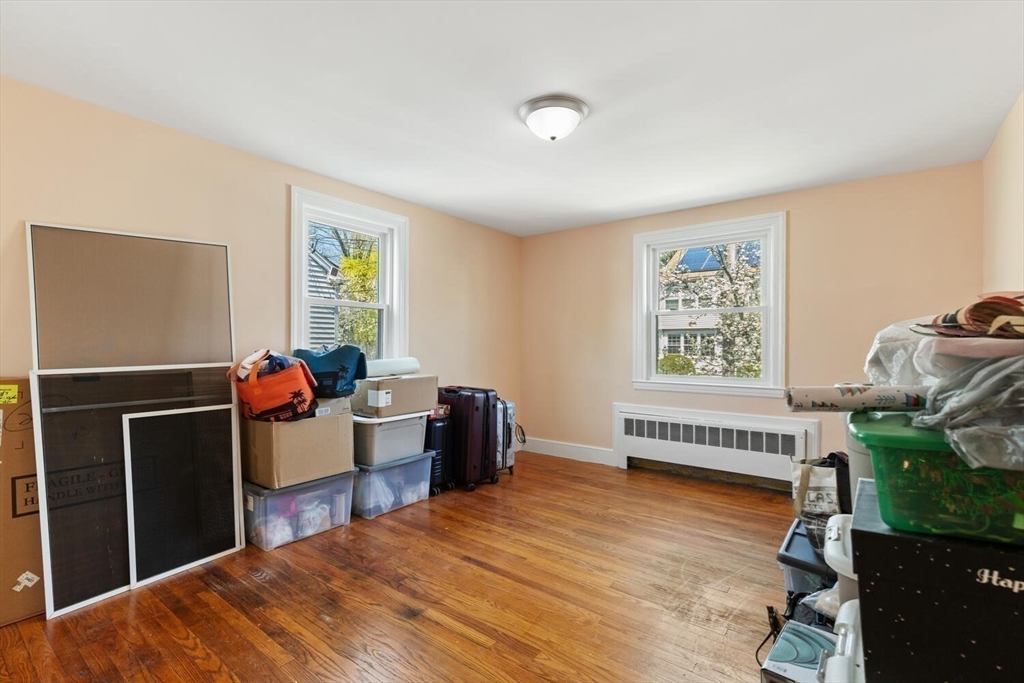 152 Springvale Avenue Everett, MA 02149 - Photo 17 of 30 a bedroom with a bed and a window