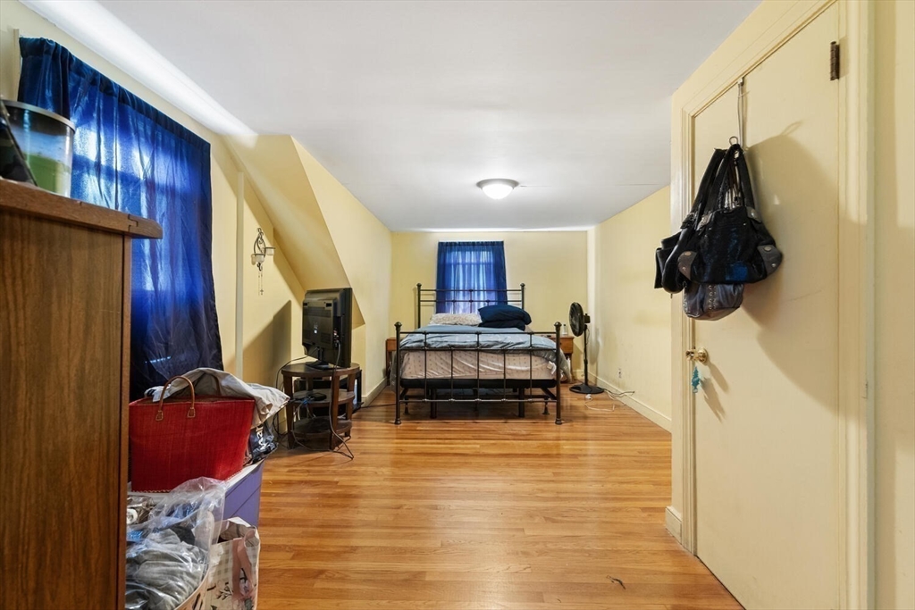 152 Springvale Avenue Everett, MA 02149 - Photo 23 of 30 a room with furniture and wooden floor