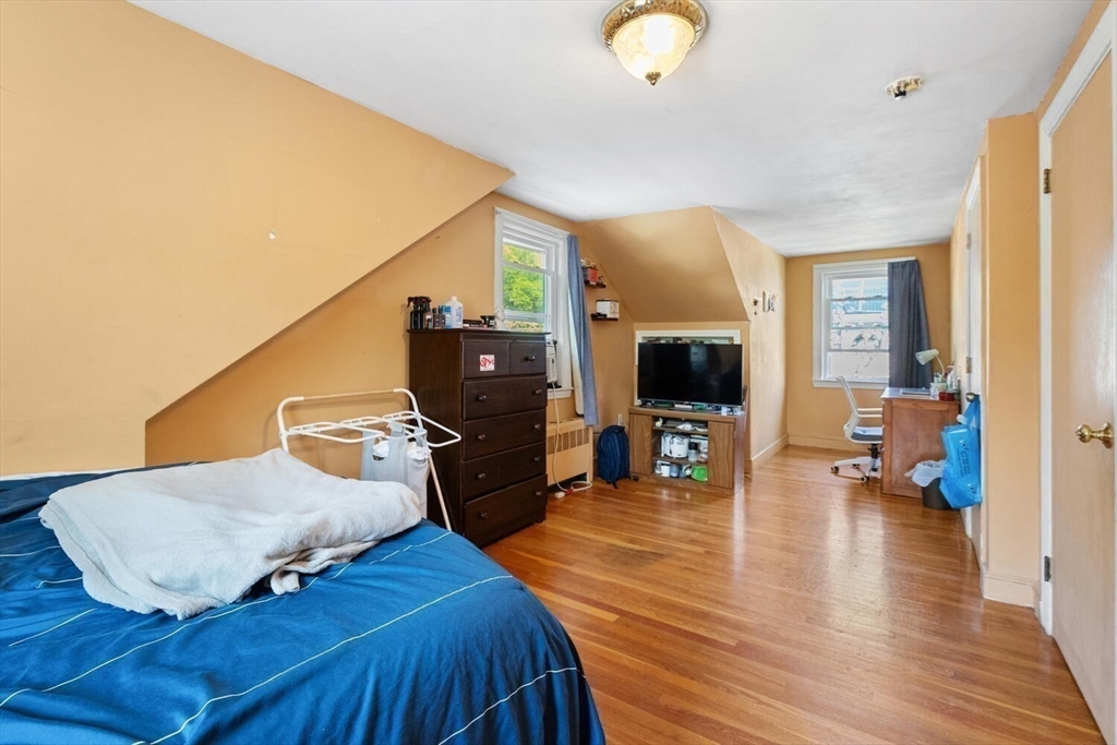152 Springvale Avenue Everett, MA 02149 - Photo 25 of 30 a living room with furniture and a fireplace