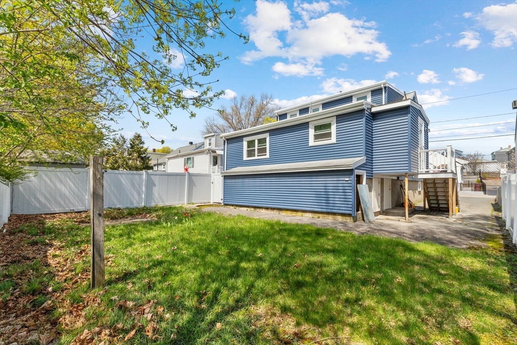 152 Springvale Avenue Everett, MA 02149 - Photo 4 of 30 a view of a house with backyard and a tree