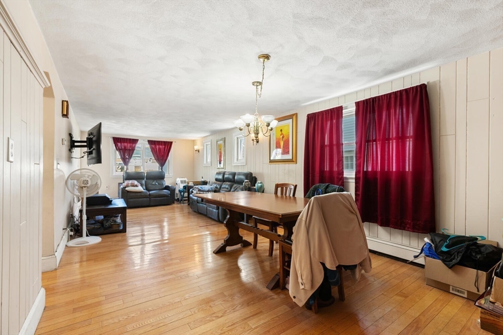 152 Springvale Avenue Everett, MA 02149 - Photo 7 of 30 a workspace with furniture window and wooden floor