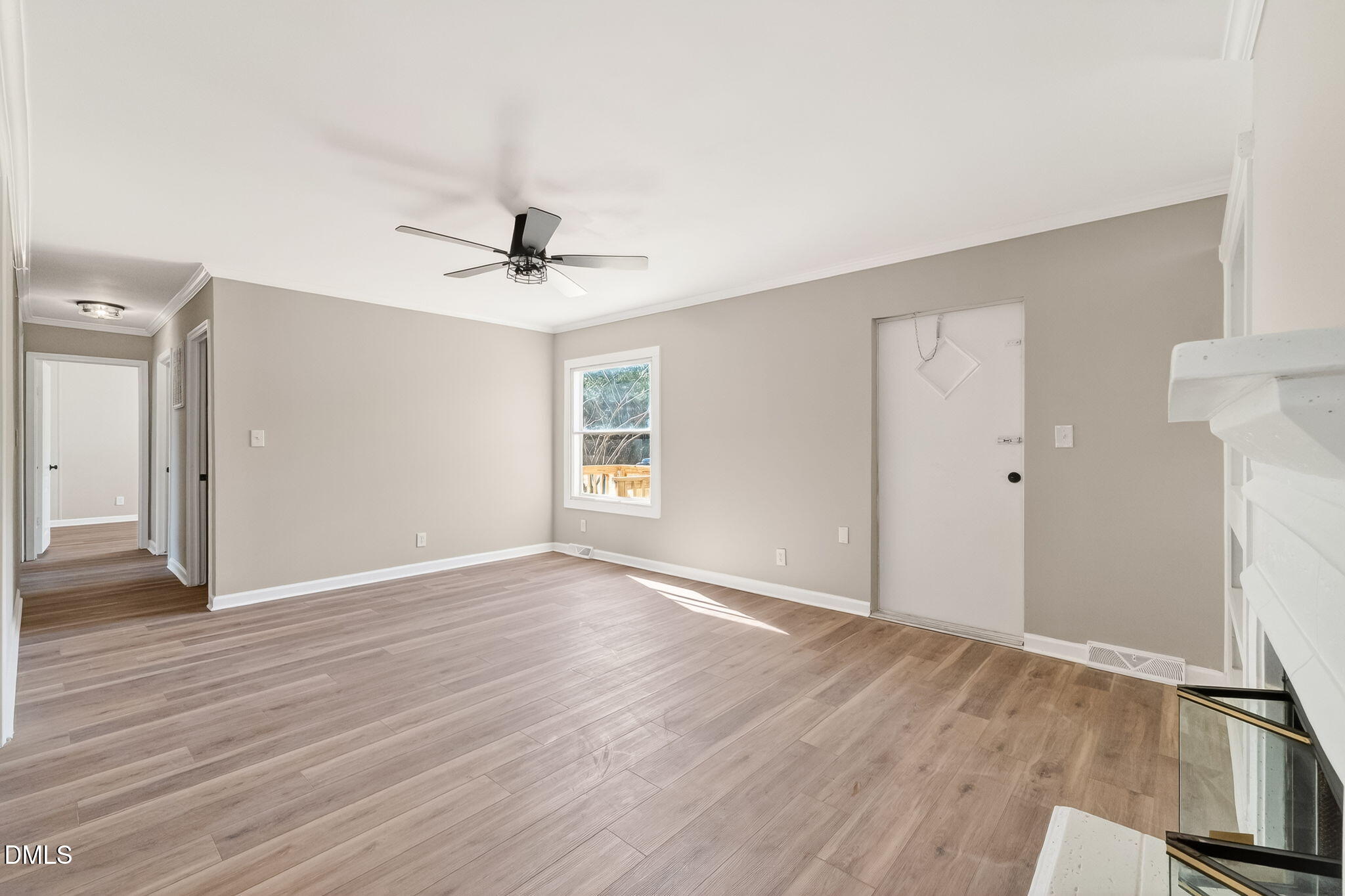 10015 Smith Road Middlesex, NC 27557 - Photo 14 of 48 an empty room with wooden floor and a ceiling fan