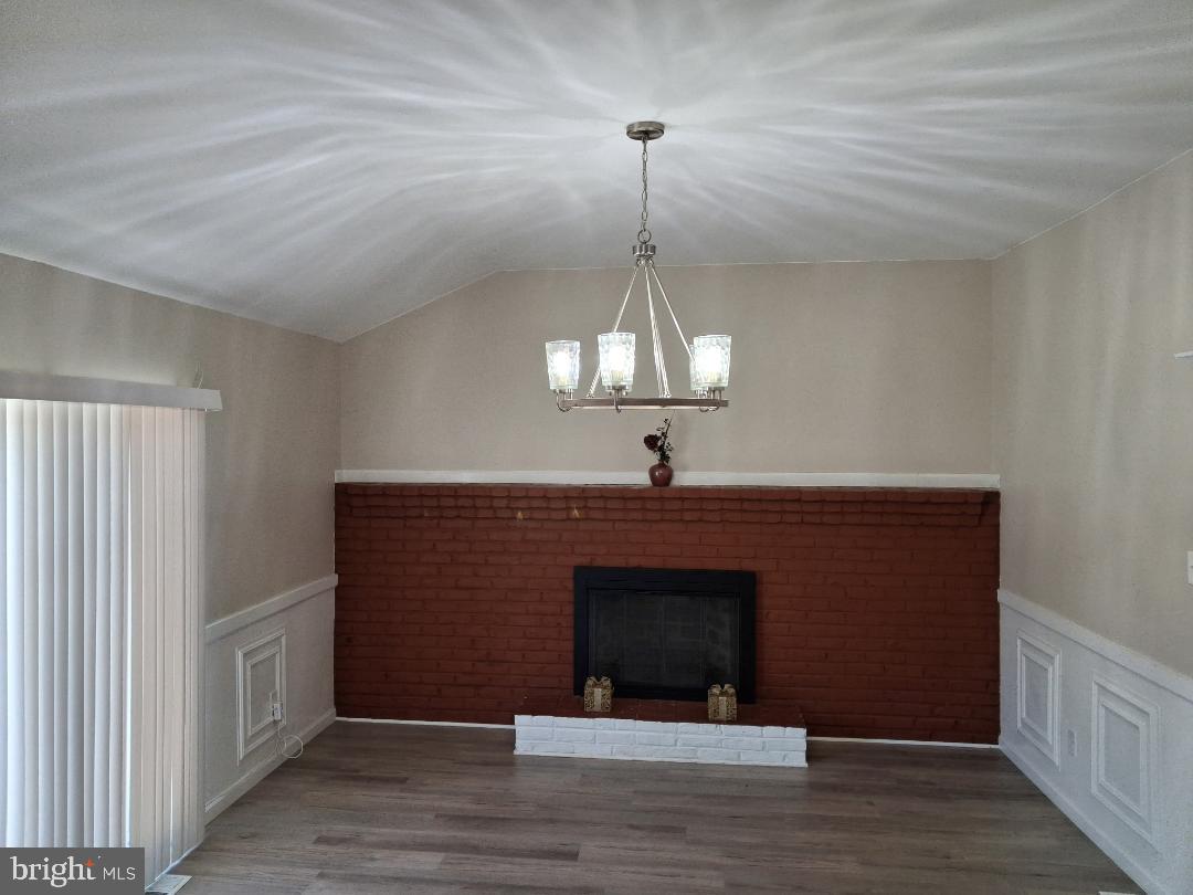 119 Colonial Road Beverly, NJ 08010 - Photo 5 of 13 STEP DOWN family room. Wood burning fireplace!