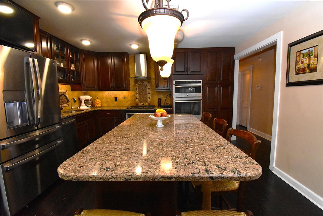 424 Grape Street Whitehall, PA 18052 - Photo 12 of 50 This spacious kitchen offers a large island with ample counter space for culinary endeavors.