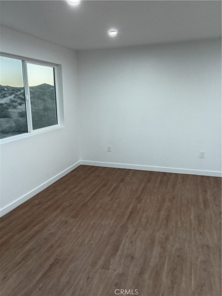 66954 Appian Way Joshua Tree, CA 92252 - Photo 13 of 26 a view of wooden floor and windows in a room
