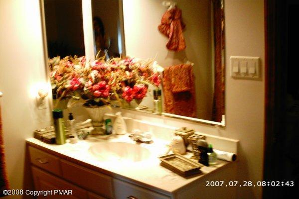 2701 Devon Road Tobyhanna, PA 18466 - Photo 10 of 10 a bathroom with a sink and a mirror